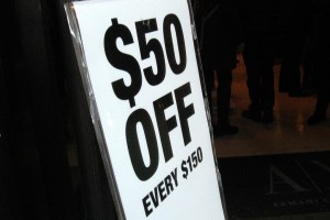 A sale sign in front of a store during Black Friday