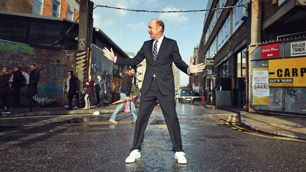 Stan Smith wearing his eponymous shoe