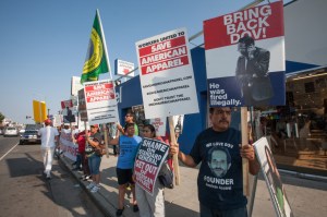 Workers demonstrate outside American Apparel’s store on Melrose Avenue