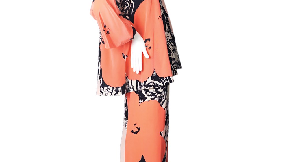 A silk pantsuit desinged by Halston in 1974. The print is based on Andy Warhol's 1967 pring "Flowers."