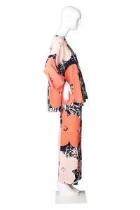 A silk pantsuit desinged by Halston in 1974. The print is based on Andy Warhol's 1967 pring "Flowers."