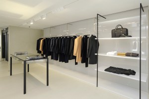 Suits and coats are showcased on long rails