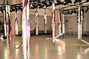 10:04 a.m.: A very postmodern set for this show. Tree branches tied to fluorescent lights. Very nature meets the electronic world.
