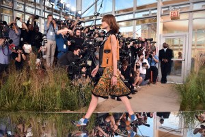 4:33 p.m.: I take one of the greatest photographs of my life. The runway is made of mirrors and I get the reflection of the photographers shooting with the foot of a model stepping on them. Art imitates life.
