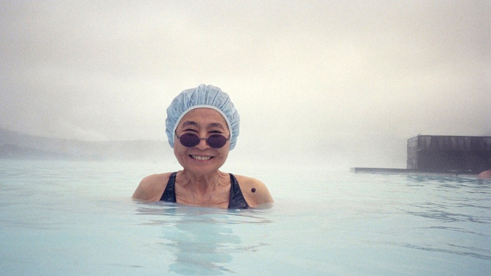 Yoko Ono in a mineral pool in Iceland photographed by Michele Civetta.