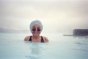 Yoko Ono in a mineral pool in Iceland photographed by Michele Civetta.