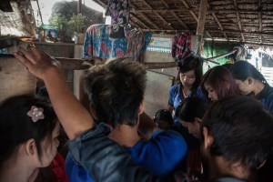 Factory workers listen to their Union Leader speak on October 13, 2015. On August 29 2015, the government of Myanmar announced a minimum wage of 3,600 kyats (about 3 US$). This slight pay raise was met with hostilities by factory owners in the Garment Industries who either refused to increase pay at all, made layoffs to keep expenses the same or cut overtime pay and benefits. Even those garment factory workers who have seen a increase in their daily wages have seen very little change in their salaries overall.
