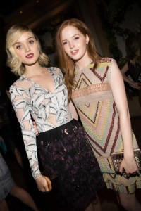 Bella Heathcote in Thakoon with Ellie Bamber in Valentino.