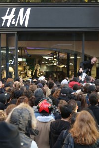 Scuffling to enter the H&M store on the Avenue des Champs-Elysées