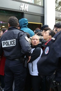 Police officers outside the H&M store on the Champs-Elysées