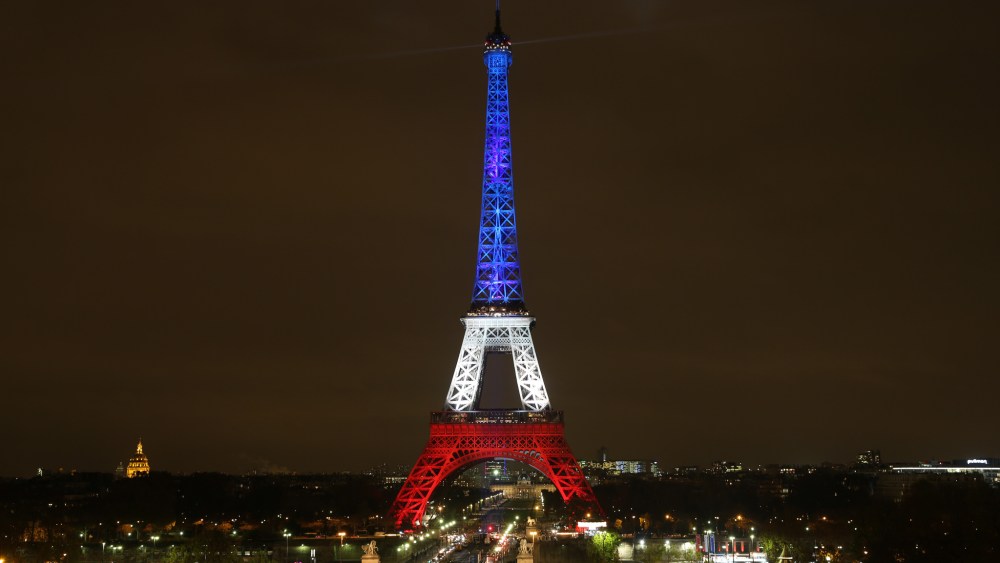 The Eiffel Tower lit in the colors of the French flags – blue, white and red, starting Monday night through to Wednesday.