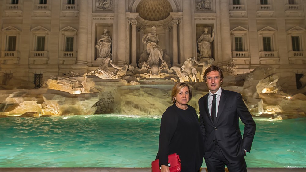 Pietro Beccari and Silvia Venturini Fendi in front of the restored Trevi Fountain.