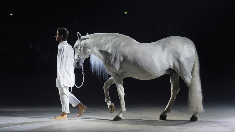 Jacquemus designer Simon Porte Jacquemus leading a white steed