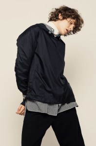 Our Legacy’s nylon jacket, cotton shirt, linen turtleneck and cotton shorts.