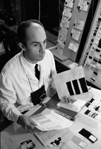 André Courrèges working with fabric swatches, 1967.