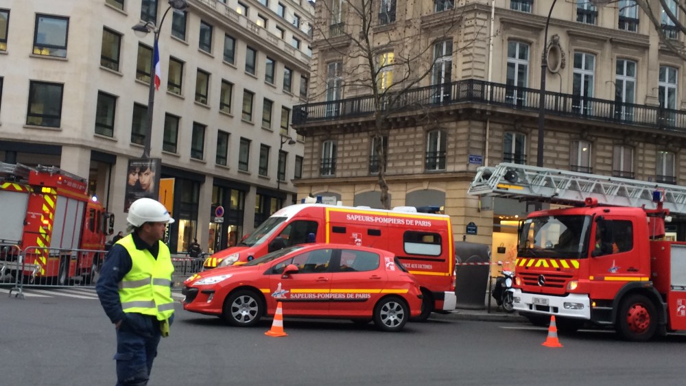Firefighters blocking the Rue Cambon after a fire broke at the Ritz Paris hotel