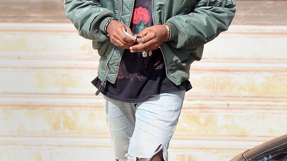 Kanye West wearing Alpha Industries MA-1 Yeezus tour jacket.