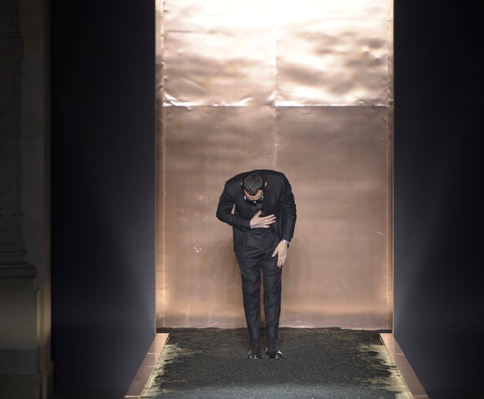 Alessandro Sartori taking a bow at his last Berluti show in Paris