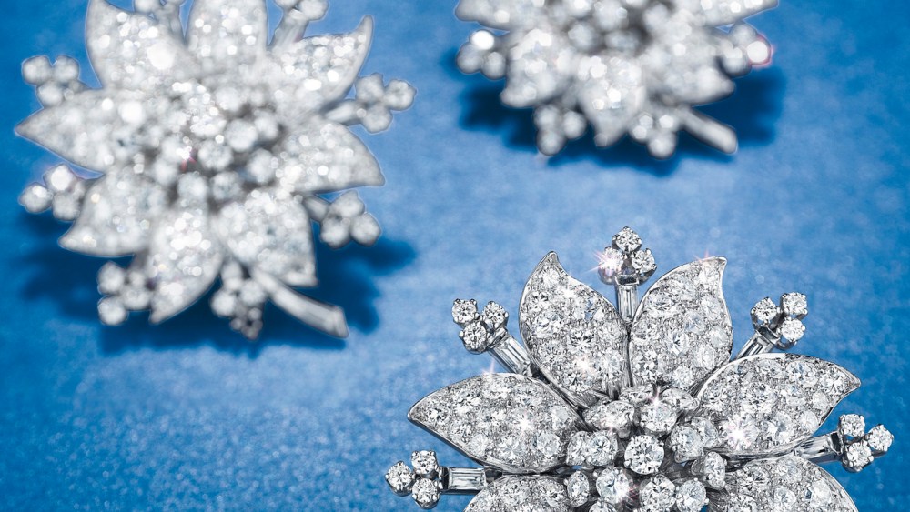 A diamond flower necklace with three detachable brooches by Van Cleef & Arpels