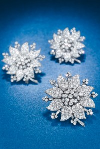 A diamond flower necklace with three detachable brooches by Van Cleef & Arpels