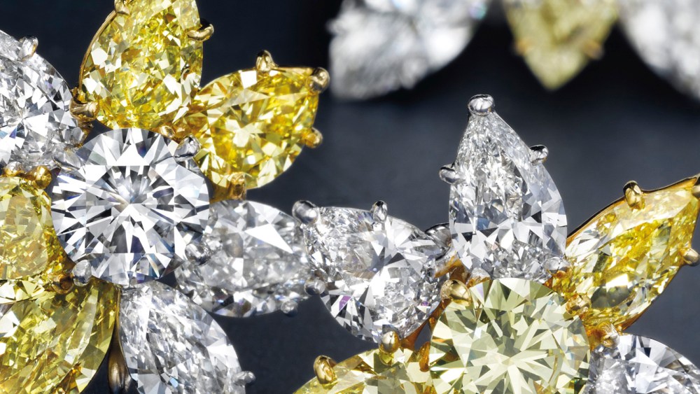 A pair of colored diamond and diamond ear clips by Cartier.