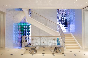 HD video montages flashing in the stairwell and a Barberini & Gunnell bench.