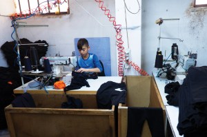 Up to 500,000 refugees could be working in the Turkish apparel industry, and many of them are children, like the one seen here.