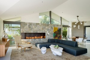 Steven Shortridge and Andrew Benson fitted the living/dining room of this updated 1960s house with a round Polanco dining table from antique dealers Blackman Cruz, a B&B Italia sofa, a sculptural coffee table by Joris Laarman, and a custom floating credenza. All share good-design pedigrees.