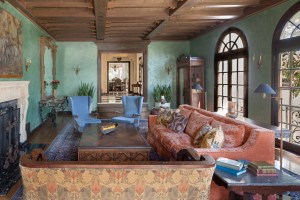 Furnishings of different periods and provenances create a beguiling mix in a living room designed by Linda Brettler. The blue wingback chairs are 1940s Italian, by Paolo Buffa.
