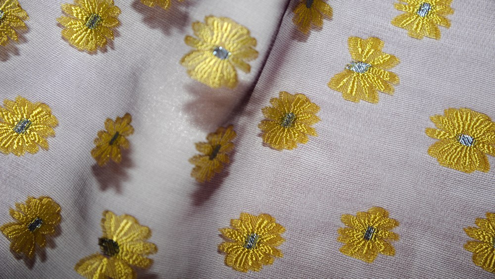A floral fil coupe design on a chiffon base by Sfate & Combier.