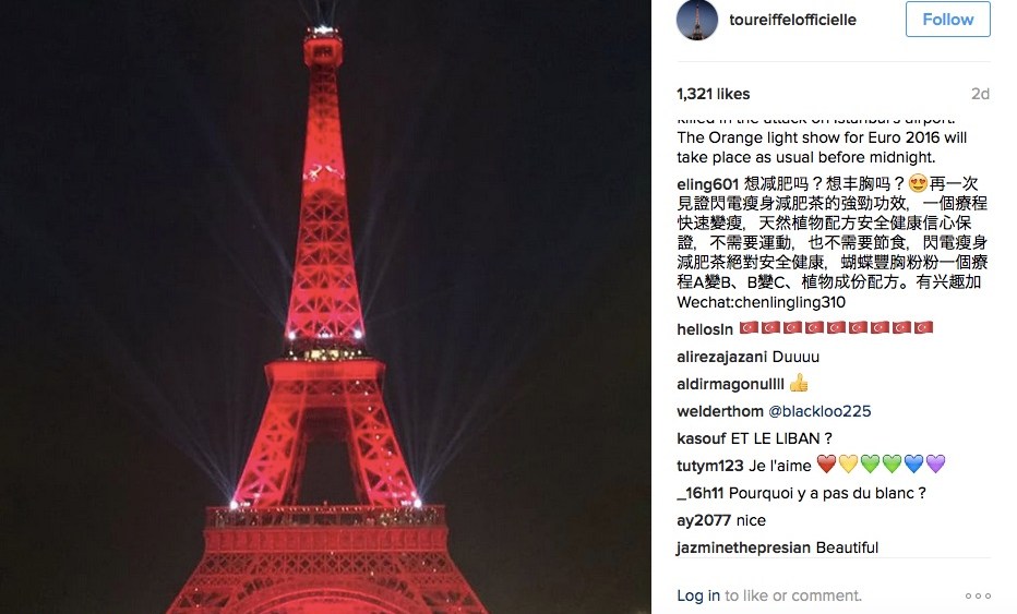 The Eiffel Tower lit up in red to honor people killed in Istanbul's airport attacks