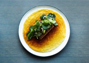 A dish at 108 restaurant in Copenhagen: caramelized milkskin with grilled pork belly and spicy herbs
