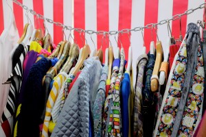 Clothing hangs from a length of industrial chain at the Hayatochiri boutique.