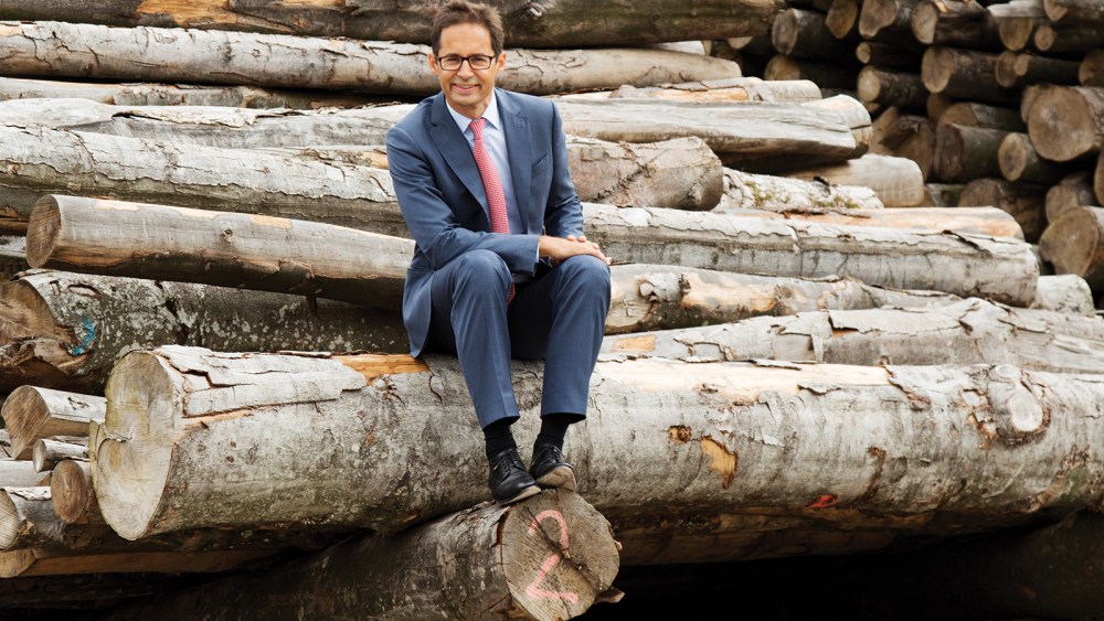 Stefan Doboczky sits on the raw material at Lenzing headquarters