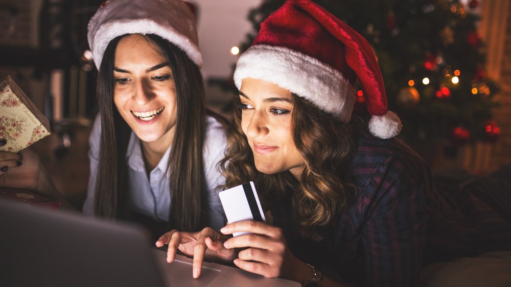 Millennial Christmas laptop online shopping