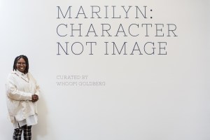 Whoopi Goldberg poses outside of "Marilyn: Character Not Image."