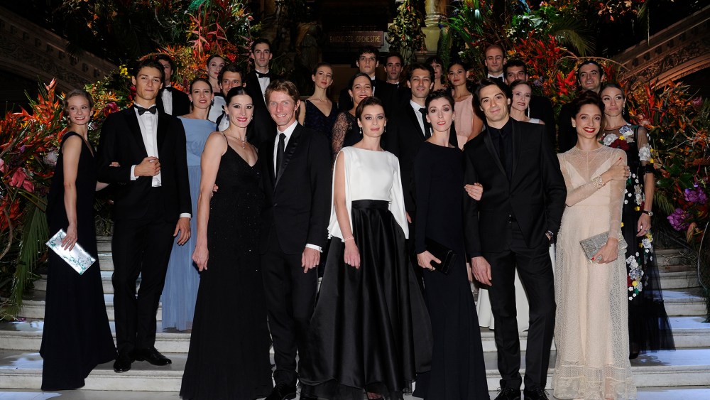 Aurélie Dupont on the grand staircase of the Palais Garnier with dancers from the Paris Opera