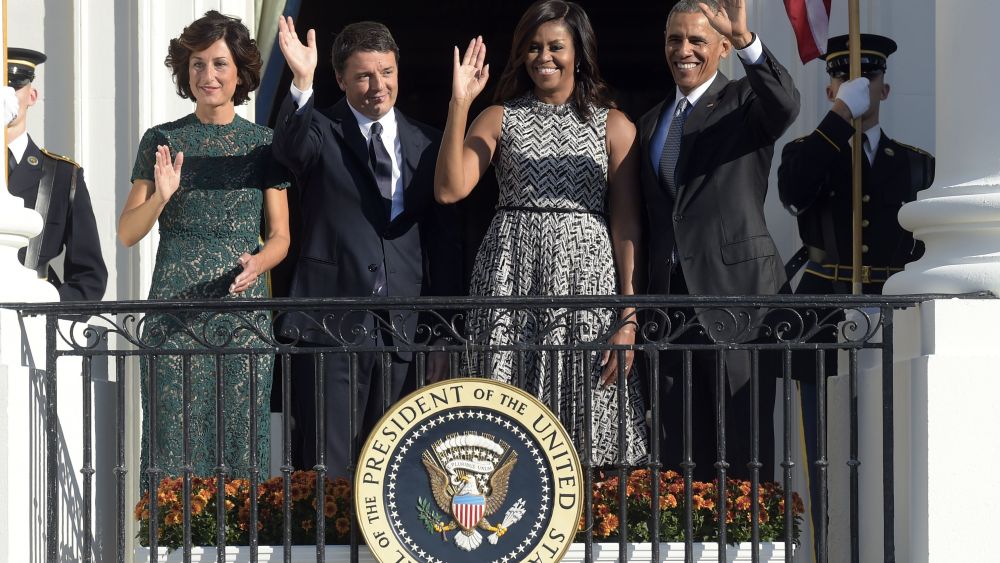 President Barack Obama, first lady Michelle Obama, Italian Prime Minister Matteo Renzi and his wife Agnese Landini, wave from the Truman Balcony of the White House in Washington.