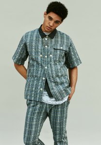 Sacai’s polyester and cotton shirt and pants and cotton tank. Praise of Poison necklaces.