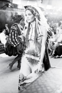 Galliano’s Princess Pocahontas, in a Dior Couture show that also featured scantily clad warrior braves in full face paint, fall 1998.