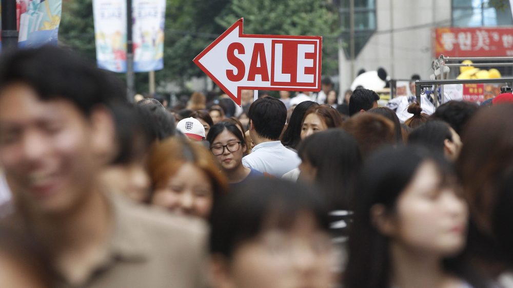 Shoppers fill a street in Seoul, South Korea.