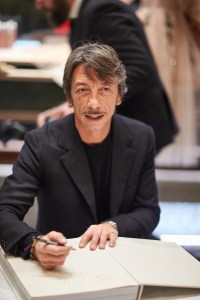 Pierpaolo Piccioli signs books at the opening of the new Moscow flagship.