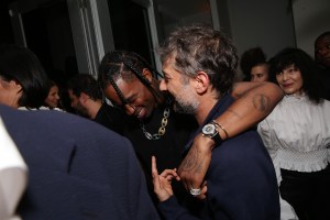 Travis Scott wearing Saint Laurent and Harmony Korine