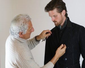 Joseph Abboud fitting a model in a preview Fall 2017 look.
