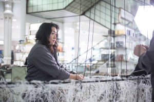 Chiharu Shiota working on her Installation at Le Bon Marché.