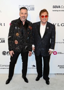 Sir Elton John in Burberry with David Furnish in Saint Laurent Elton John AIDS Foundation Oscar Party