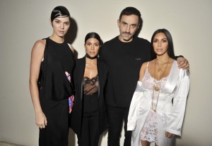 Kendall Jenner, Kourtney Kardashian, Riccardo Tisci and Kim Kardashian backstage at the Givenchy Spring 2017 show