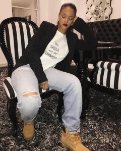 Rihanna wearing a Dior T-shirt from a collaboraton with Rihanna's The Clara Lionel Foundation.