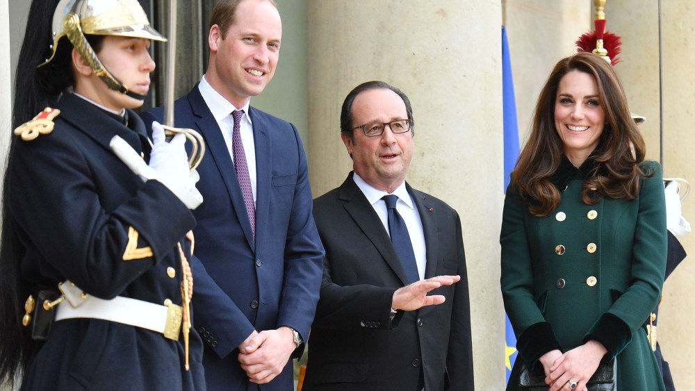 Prince William, Francois Hollande and the Duchess of Cambridge (in Catherine Walker)