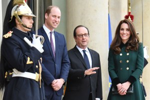 Prince William, Francois Hollande and the Duchess of Cambridge (in Catherine Walker)